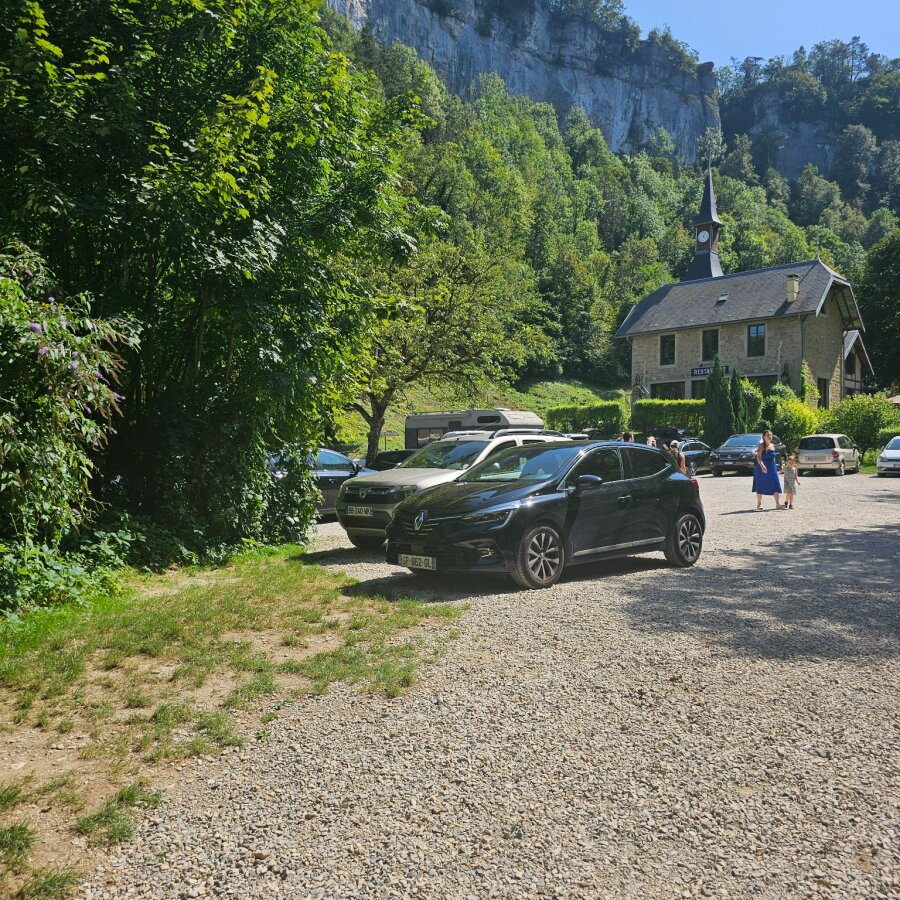 Car park beside the abbey of Baume-les-Messieurs