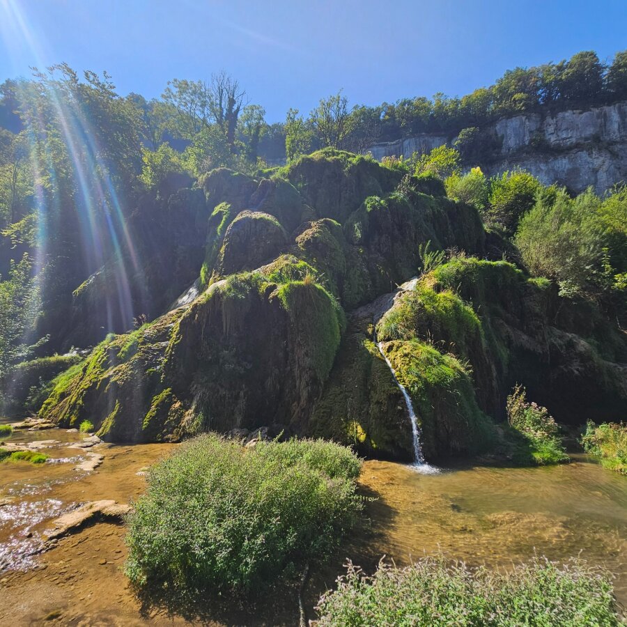 Waterfalls over moss-covered rocks in the Jura