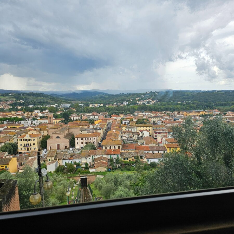 View over the rooftops from the funicular to Certaldo Alto
