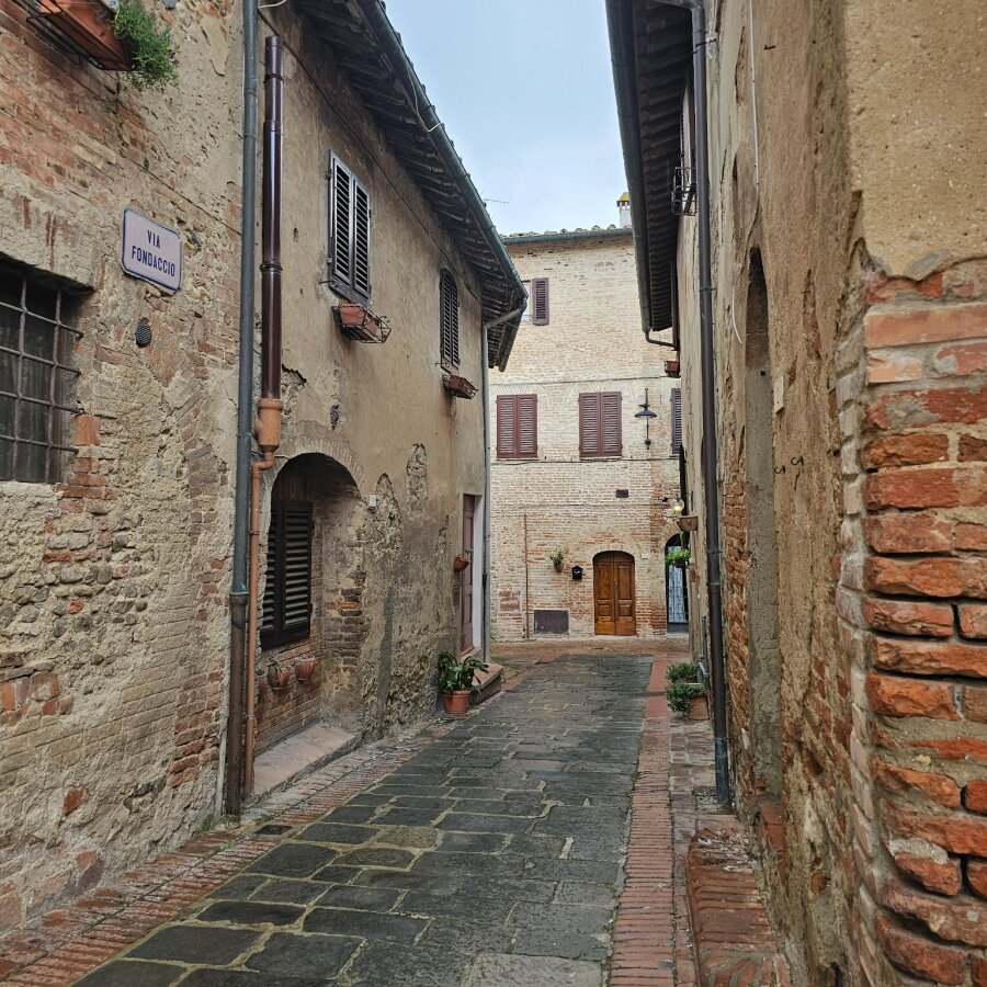 Small street with old houses in Certaldo Alto