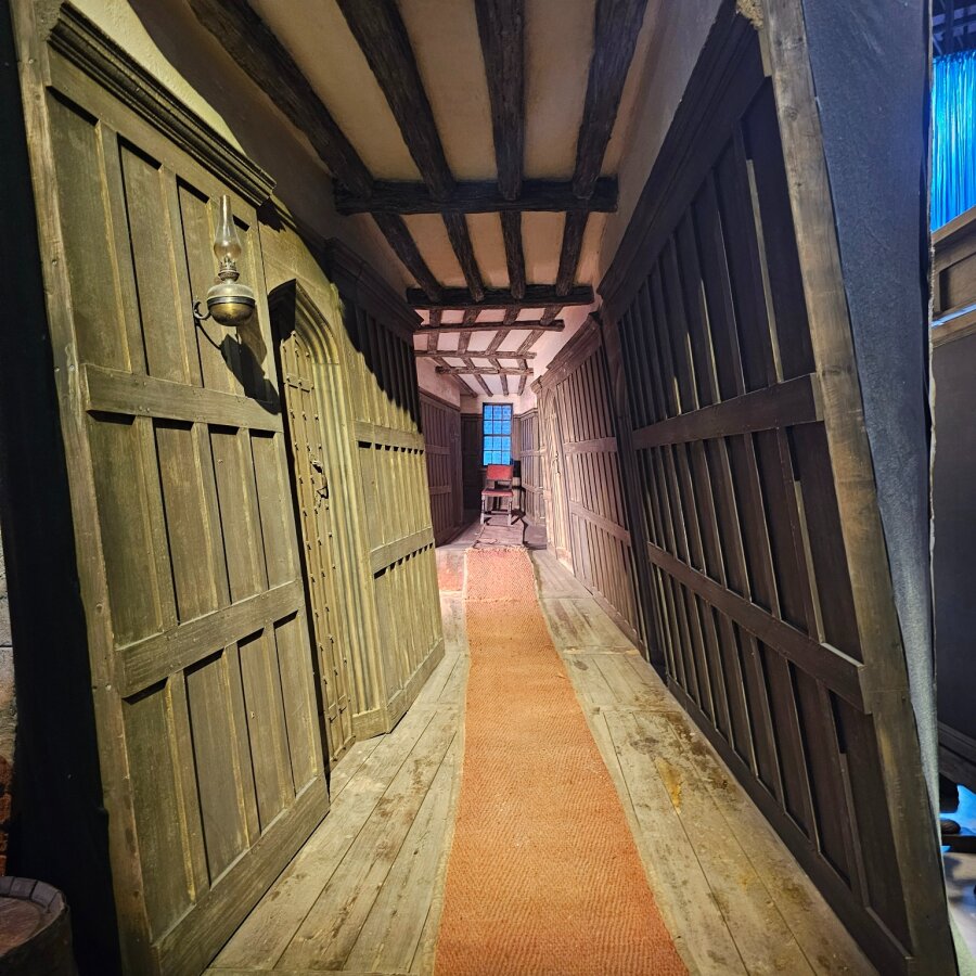 Wooden corridor with a sloping floor in the Studio Tour set