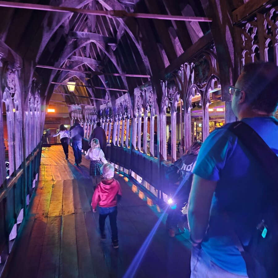 Lit corridor with visitors in the Studio Tour set
