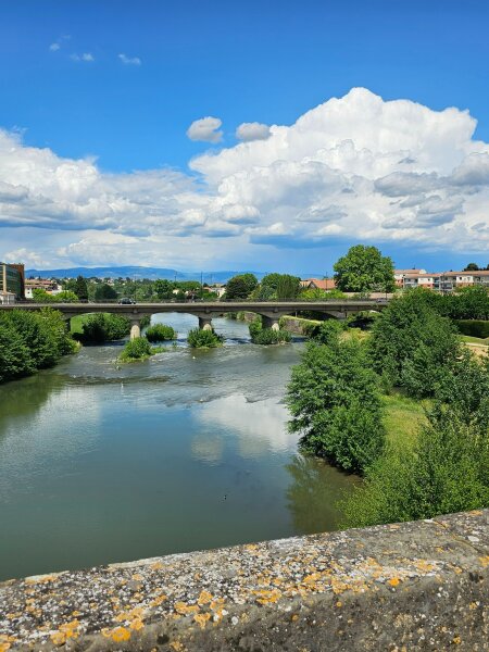 River with a bridge and green banks near Carcassonne