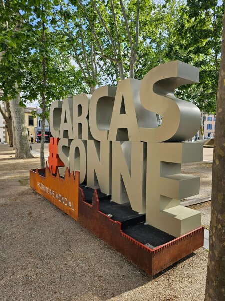 The CARCASSONNE letter sign beside the citadel