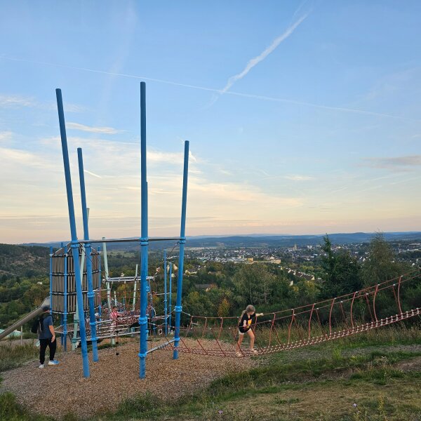 The Aventura climbing frame stretching down the slope