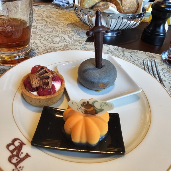 Themed desserts at Royal Banquet Disney Hotel with sword and pumpkin