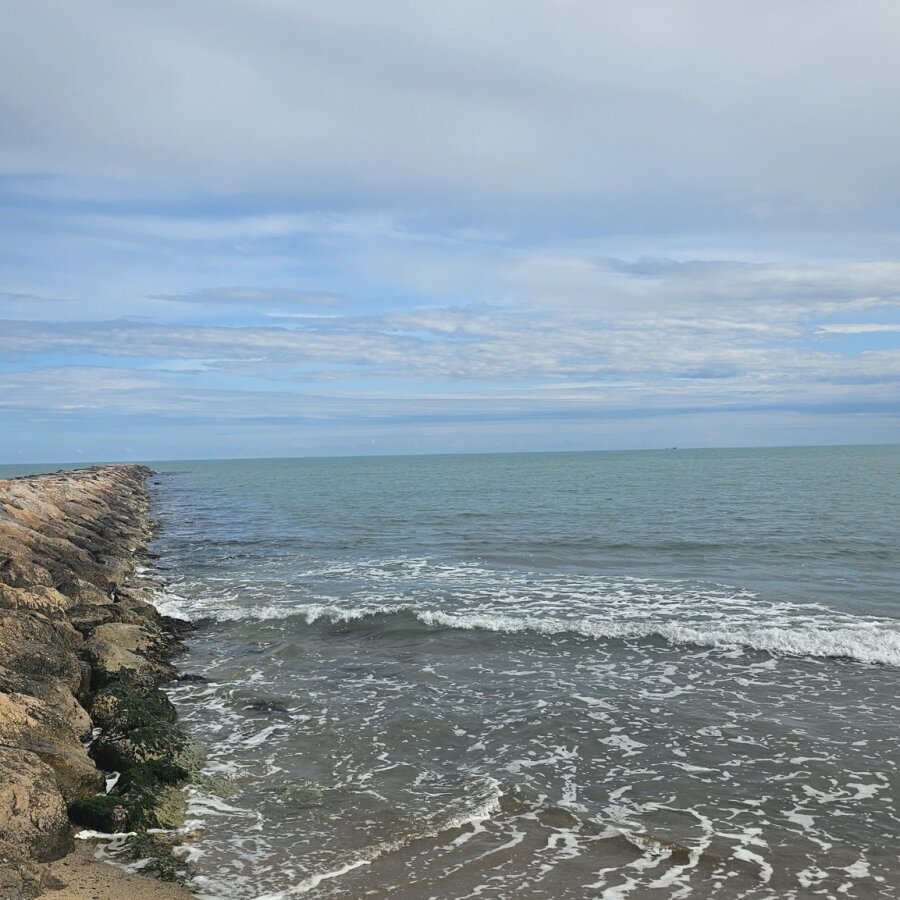 Waves on the wide beach at Puçol on the Valencia coast
