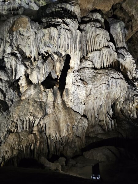 Lit dripstone formations inside the Han caves